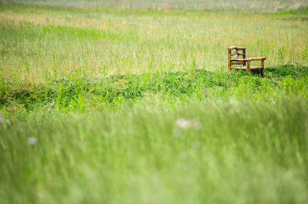 wooden bench on the field2の写真素材