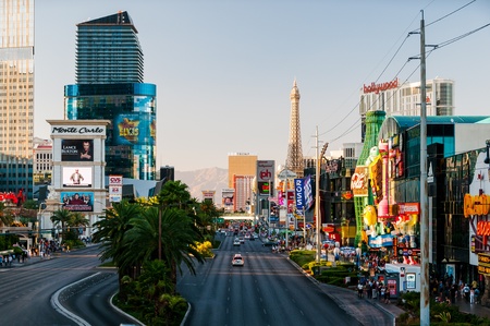 View of Las Vegas Strip  Street filled with many casinos imitating famous building from all around the world such as Aiffel Tower or New York city landmarks 