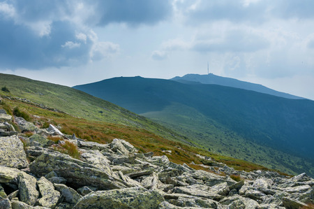 Summer mountains green grass and blue sky landscape.の写真素材