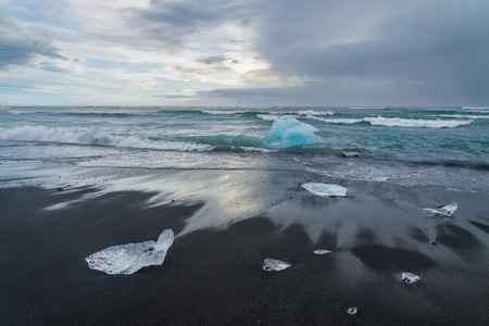 Icebergs on a black sand Jokulsarlon beach, Icelandの写真素材