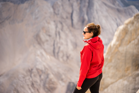 Young female tourist enjoying view of Italian Dolomites.の写真素材