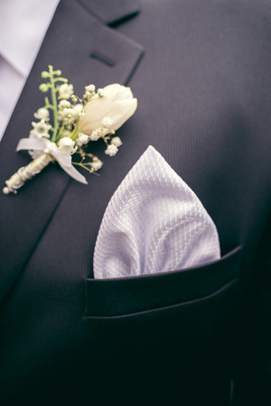 Detail view of groom's wedding suit with a handkerchief.の写真素材