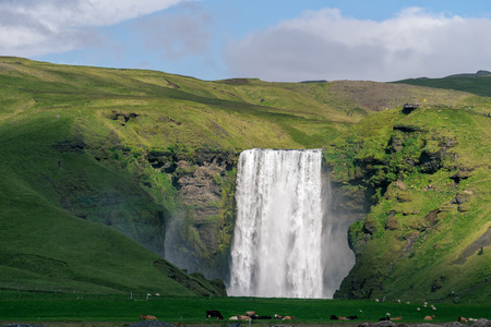 Scenic view of famous Skogafoss waterfall, South Iceland.の写真素材