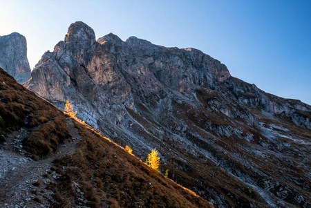 Colorful scenic view of majestic Dolomites mountains in Italian Alps. Majestic rocky mountains surrounded with grassy meadows during autumn.の写真素材