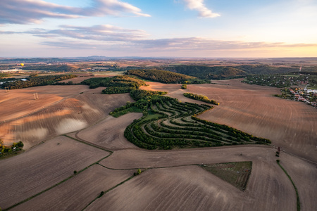 Sunset view of beautiful countryside of South Moravia viewed from above. Agricultural landscape in warm late evening light.の写真素材