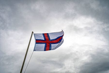 Flag of the Faroe Islands in a wind.