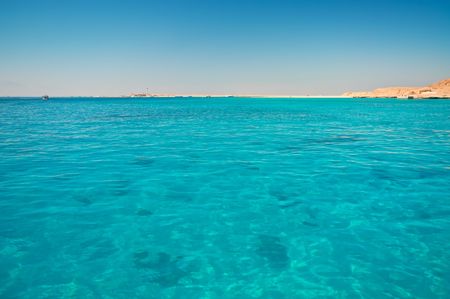 Green water and coastline in Red seaの写真素材