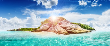 Tropical island resort. Ultramarine lagoon coastline background