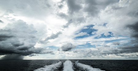 Tropical hurricane from motor boat. Water traces and splashes roadの写真素材