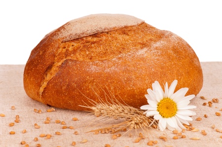 Traditional fresh round white bread isolated on white backgroundの写真素材