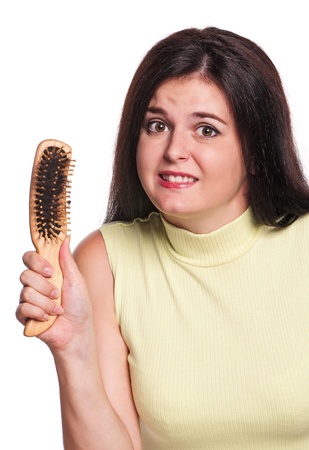 Girl with hairbrushの写真素材