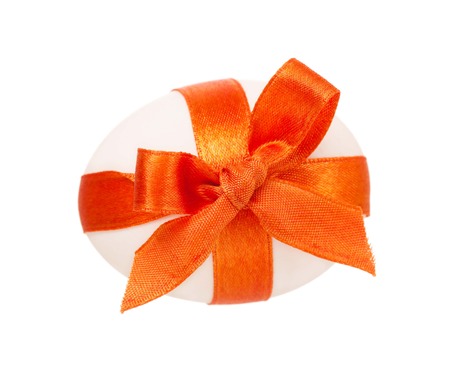 White egg decorated with bright ribbon isolated on white background cutoutの写真素材