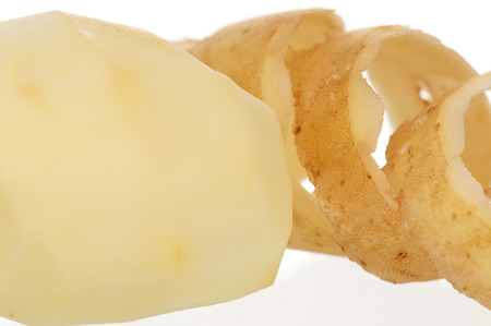 Peeled potato isolated on a white backgroundの写真素材