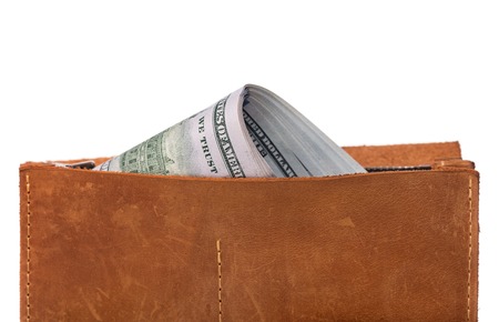 A purse of dollars isolated over white background