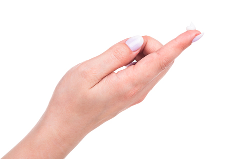 Young female hand with cream isolated over white backgroundの写真素材