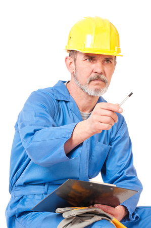 Tired adult worker isolated over white backgroundの写真素材