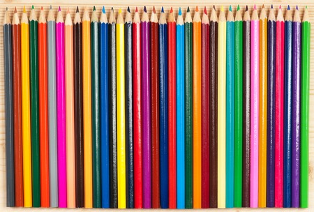 Bright colour pencils for drawing over wooden surfaceの写真素材