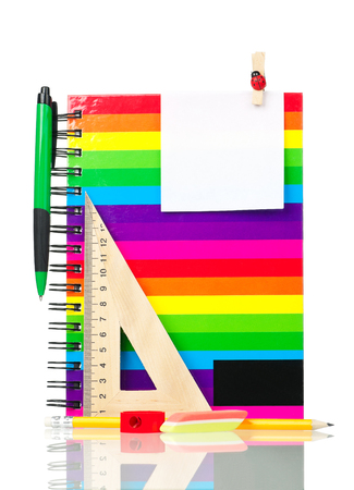 School exercise-book with bright stationery isolated over white backgroundの写真素材