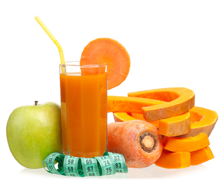 Fresh vegetable juice with tape measure isolated over white backgroundの写真素材