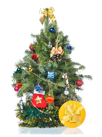 Christmas spruce with garland and presents isolated over white backgroundの写真素材