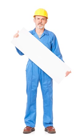 Adult worker in a uniform with blank billboard on white backgroundの写真素材