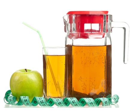 Fresh apple juice in the glass isolated on a white backgroundの写真素材