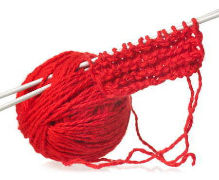 Knitting spokes with a ball of woolen threads isolated on white backgroundの写真素材