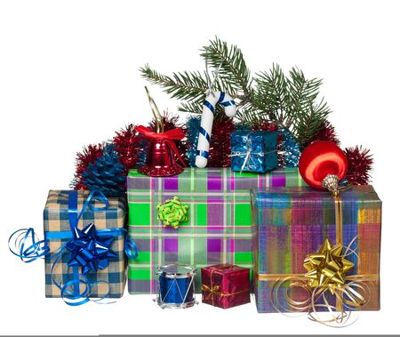 New year gifts with fir-tree toys over white backgroundの写真素材