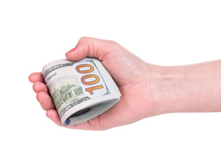 Female hands holding a lot of dollars isolated over white backgroundの写真素材