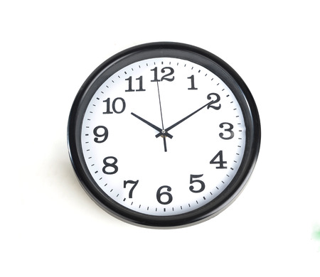 Simple classic black and white round wall clock isolated on white 