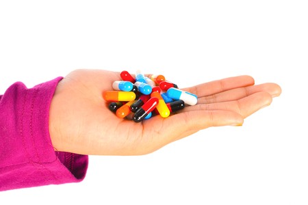 Top view of the pills on the hand and white background, A hand hold the pills and drug, Pile of the...