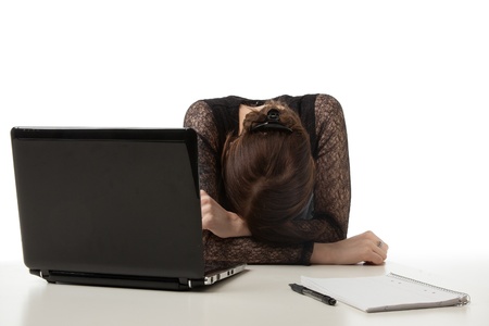 Tired woman in office の写真素材