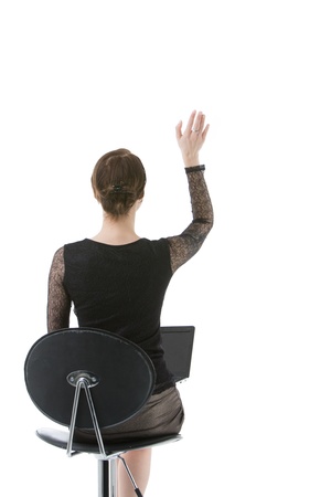 Woman raising hand, back shown の写真素材