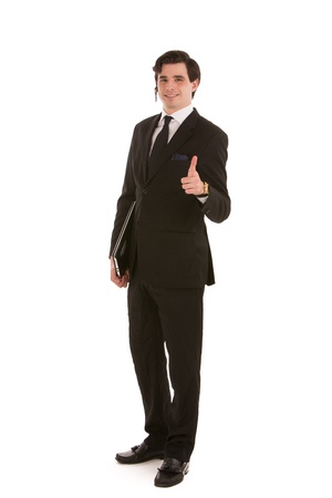 Full length studio portrait of a handsome smiling young business man giving a thumbs up gesture of approval on a white backgroundの写真素材