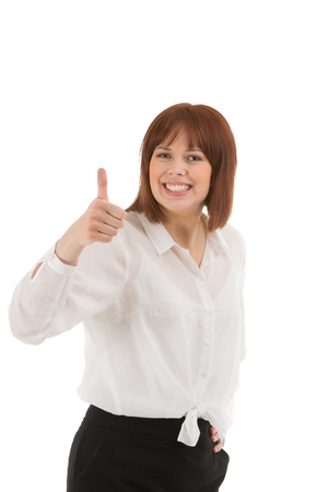 Pleased businesswoman with a lovely big smile giving a thumbs up of success and approval, upper body portrait isolated on whiteの写真素材