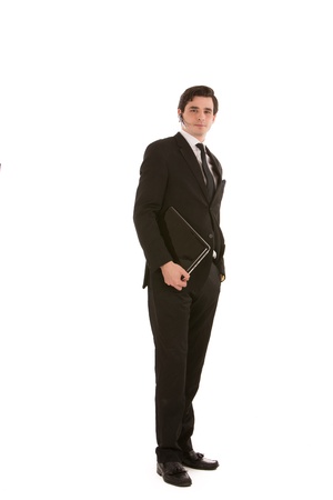 Photo of a business executive carrying the laptop in his hands の写真素材