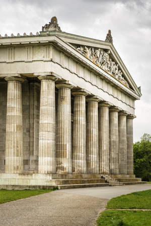 Image of the Walhalla in Bavaria Germany with green meadow and dark cloudsのeditorial素材