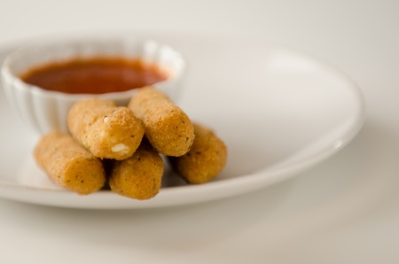 Mozzarella Sticks on White Plate with Marinara Sauceの写真素材
