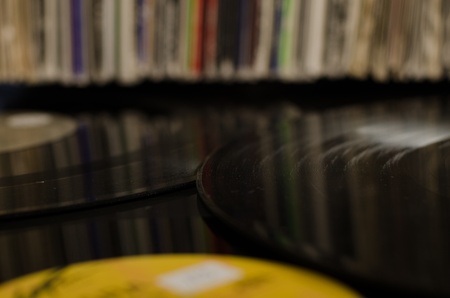 Vinyl Records reflect record sleeves in backgroundの写真素材