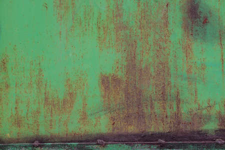 Background of peeling paint and rusty old meta. Little black dots and scratches. Corrosion of metal,...