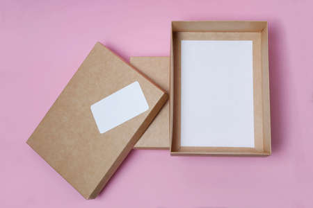 open Cardboard craft box with cover on white background top view. The concept of delivery, mail,...