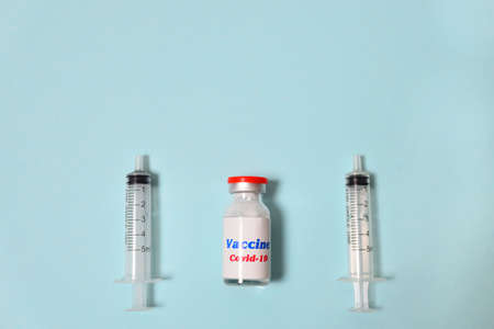 Seamless pattern glass bottle with covid-19 vaccine with red lid. New Corona virus infection novel virus disease background. Pandemic panic conceptor epidemic. prevention of seasonal vaccination.の写真素材