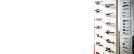 Banner shop window with a large selection of handles for interior doors. accessories for doors. home renovation concept.の写真素材