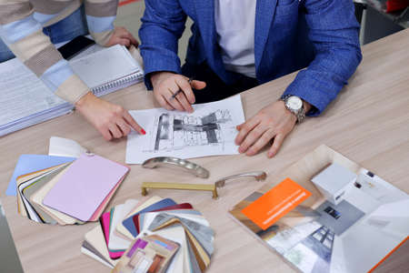 A girl in a white T-shirt holds a cup of tea and a liver in the form of a red heartの写真素材