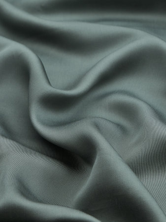 Smooth elegant gray silk or satin texture can be used as backgroundの写真素材