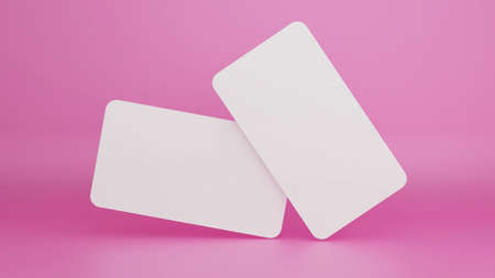 Blank white business cards isolated on pastel color background with shadow minimal concept 3D renderingの写真素材