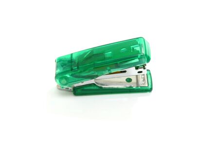Stapler green on a white background.の写真素材