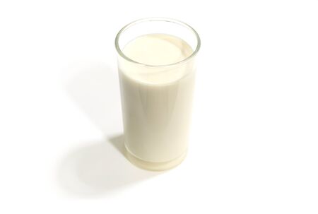 One glass of milk on a white background.の写真素材