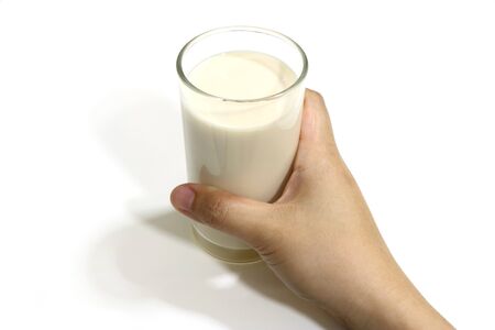 One glass of milk on a white background.の写真素材
