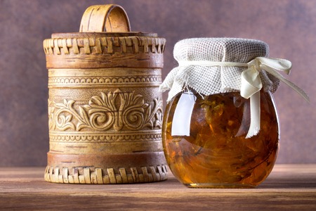 Fruit jam,marmalade in glass on wooden background.の写真素材